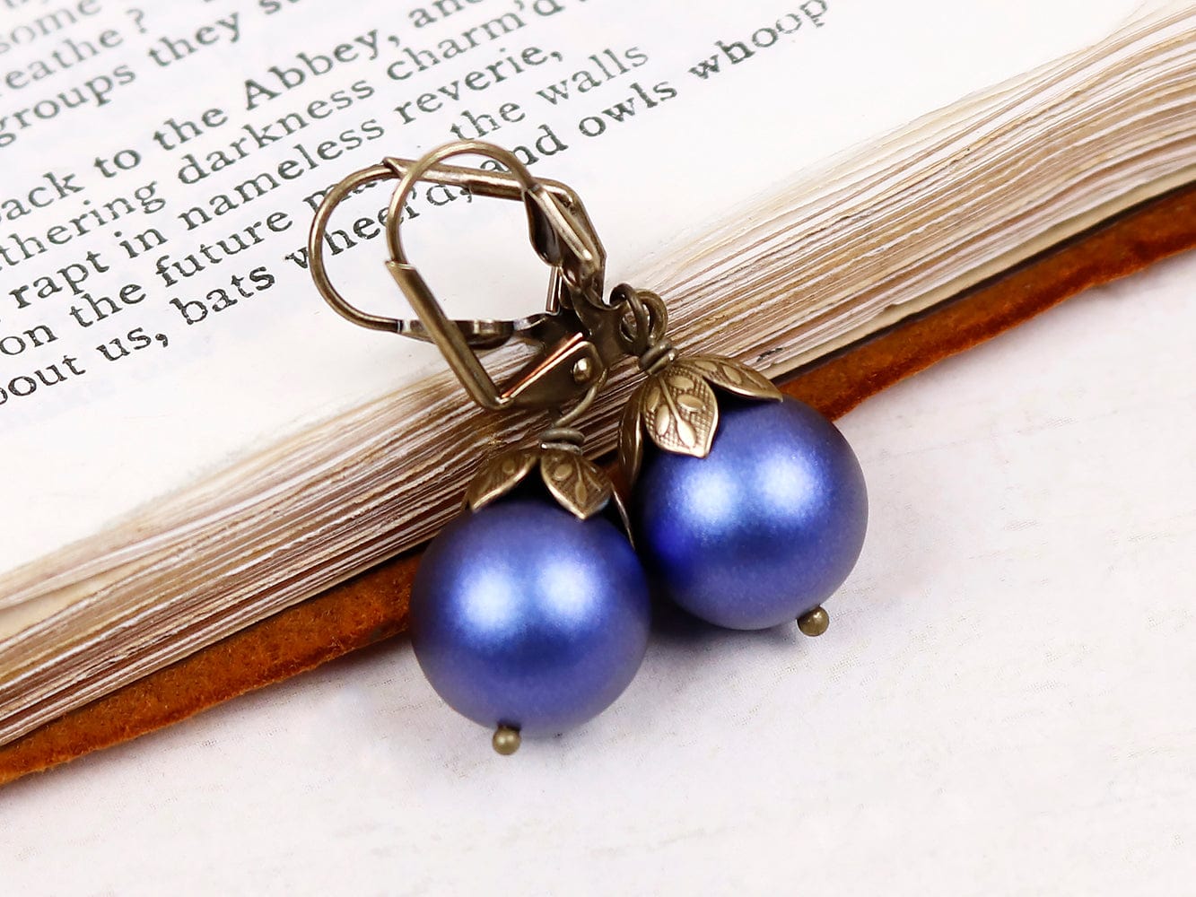 Aquitaine Pearl Drop Earrings in Iridescent Dark Blue Pearl and Antiqued Brass by Rabbitwood and Reason
