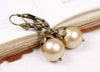 Aquitaine Pearl Drop Earrings in Gold Pearl and Antiqued Brass by Rabbitwood and Reason