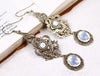 Avalon Earrings in White Opal and Antiqued Brass by Rabbitwood & Reason