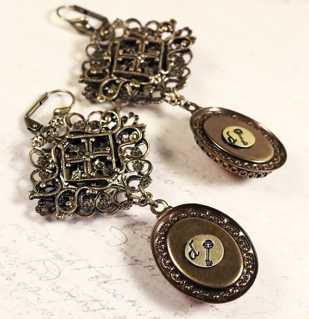 Each earring features a signature tag with Medieval key - by dosha of Rabbitwood & Reason
