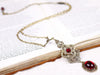 Avalon Pendant Necklace in Garnet and Antiqued Brass by Rabbitwood and Reason