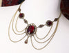Drucilla Necklace in Garnet and Antiqued Brass by Rabbitwood and Reason