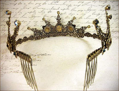 The inside of each tiara is carefully lined with antiqued metal ribbon; this attention to detail ensures Rabbitwood & Reason tiaras are aesthetically lovely from every angle, and ready for display after your special event has passed. Created by dosha of Rabbitwood & Reason.